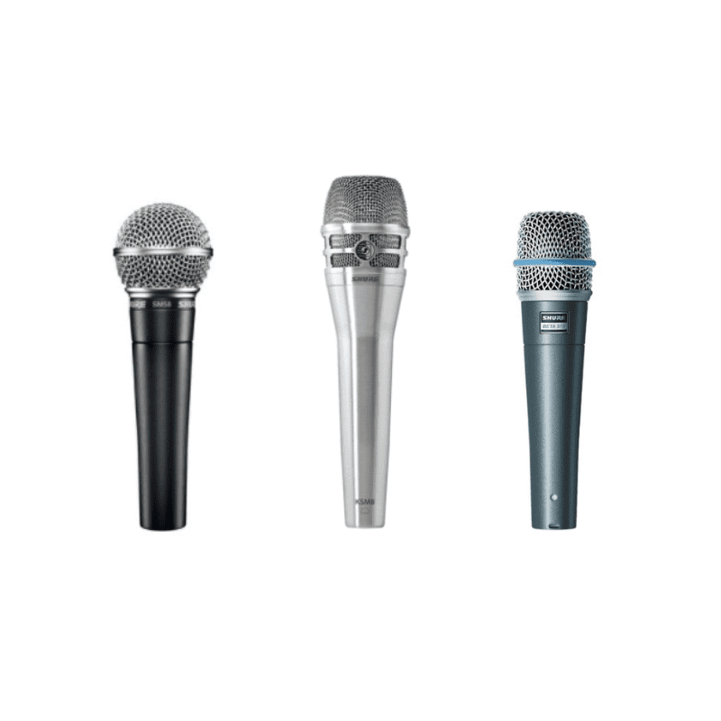 A Shure SM58 microphone, next to a a Shure KSM8 Dualdyne microphone, next to a Shure Beta 57A microphone